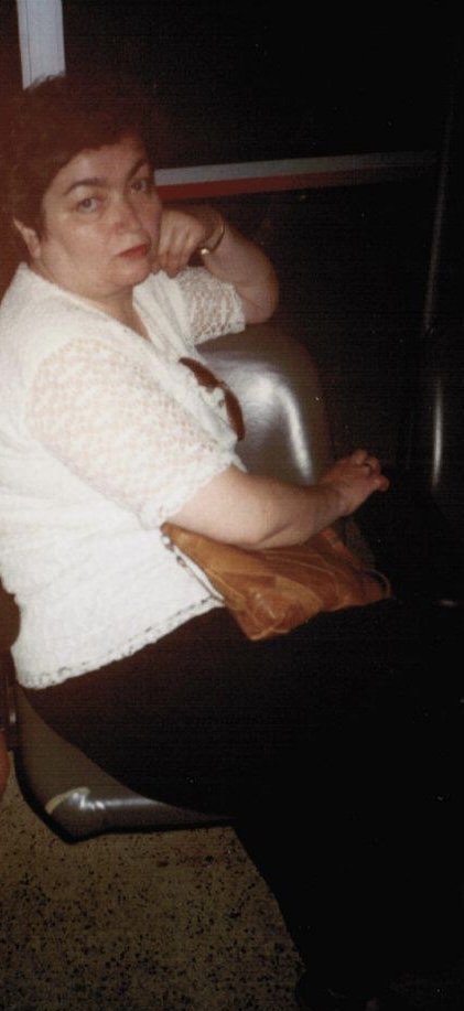    Mom waiting for my sister to arrive at the JFK arrivals terminal. June 1996.   