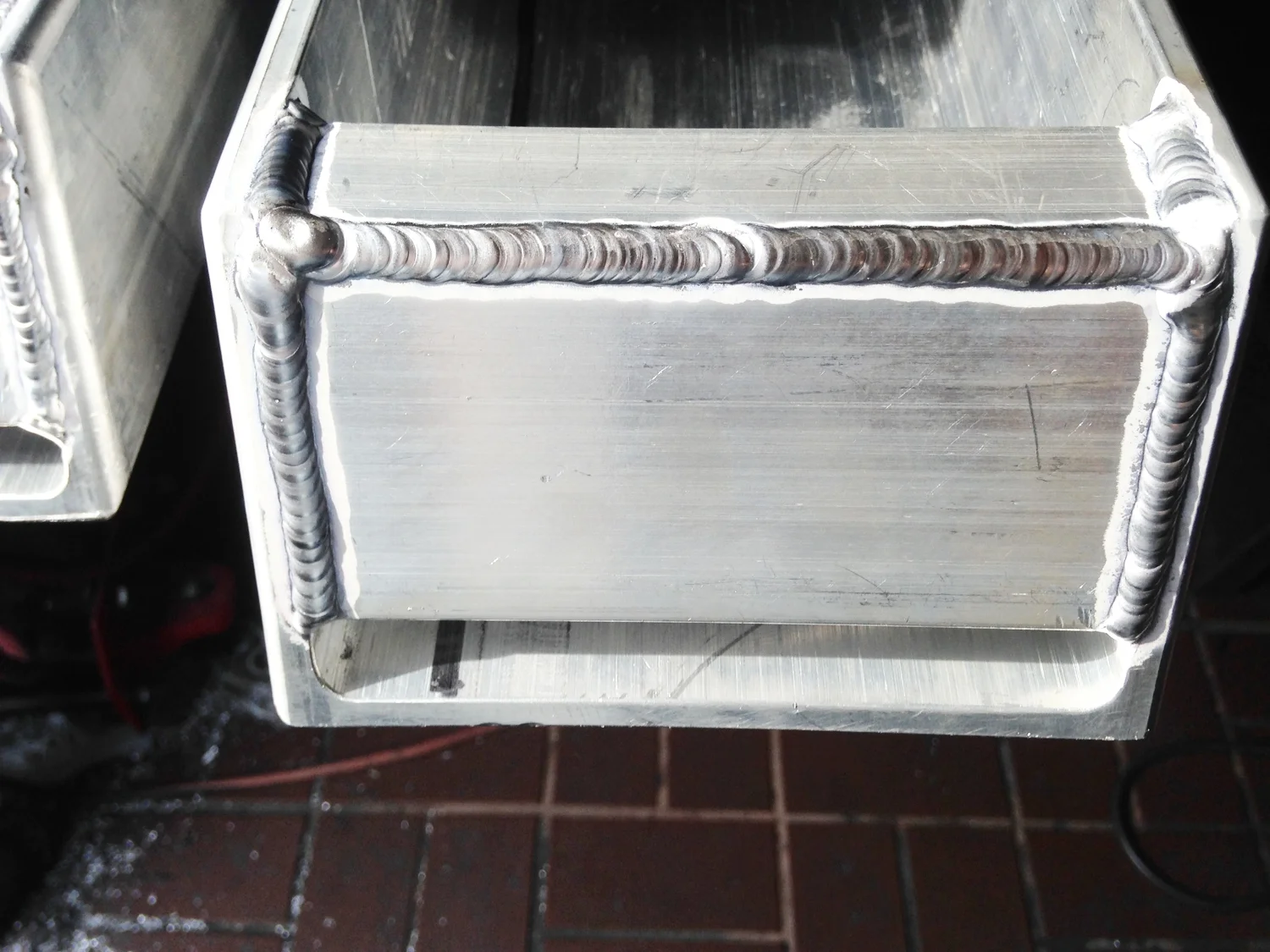 The bottom of the channels are capped and have a place to stick magnets to hold closure panels closed.