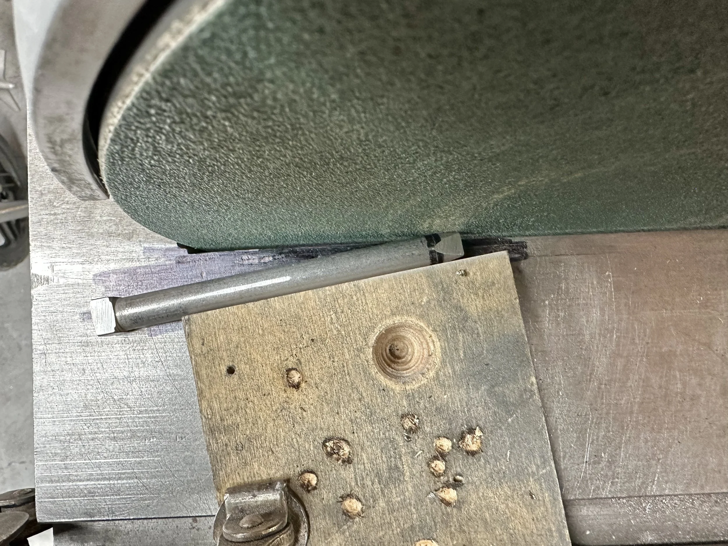   A rudimentary jig was clamped to the sander table to achieve the angle of the flats on the end of the shaft.  