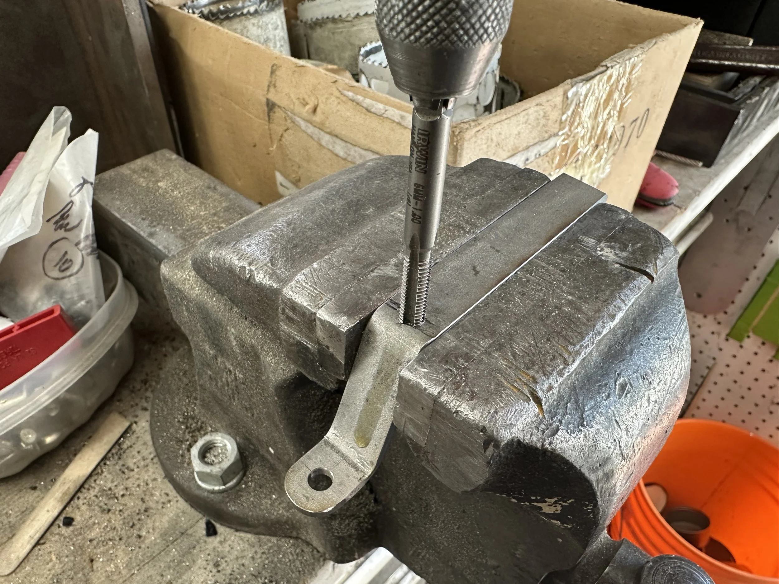   Next was to drill and tap the flatbar to receive the screw that would be both the spring retainer and counter weight locating pin.  