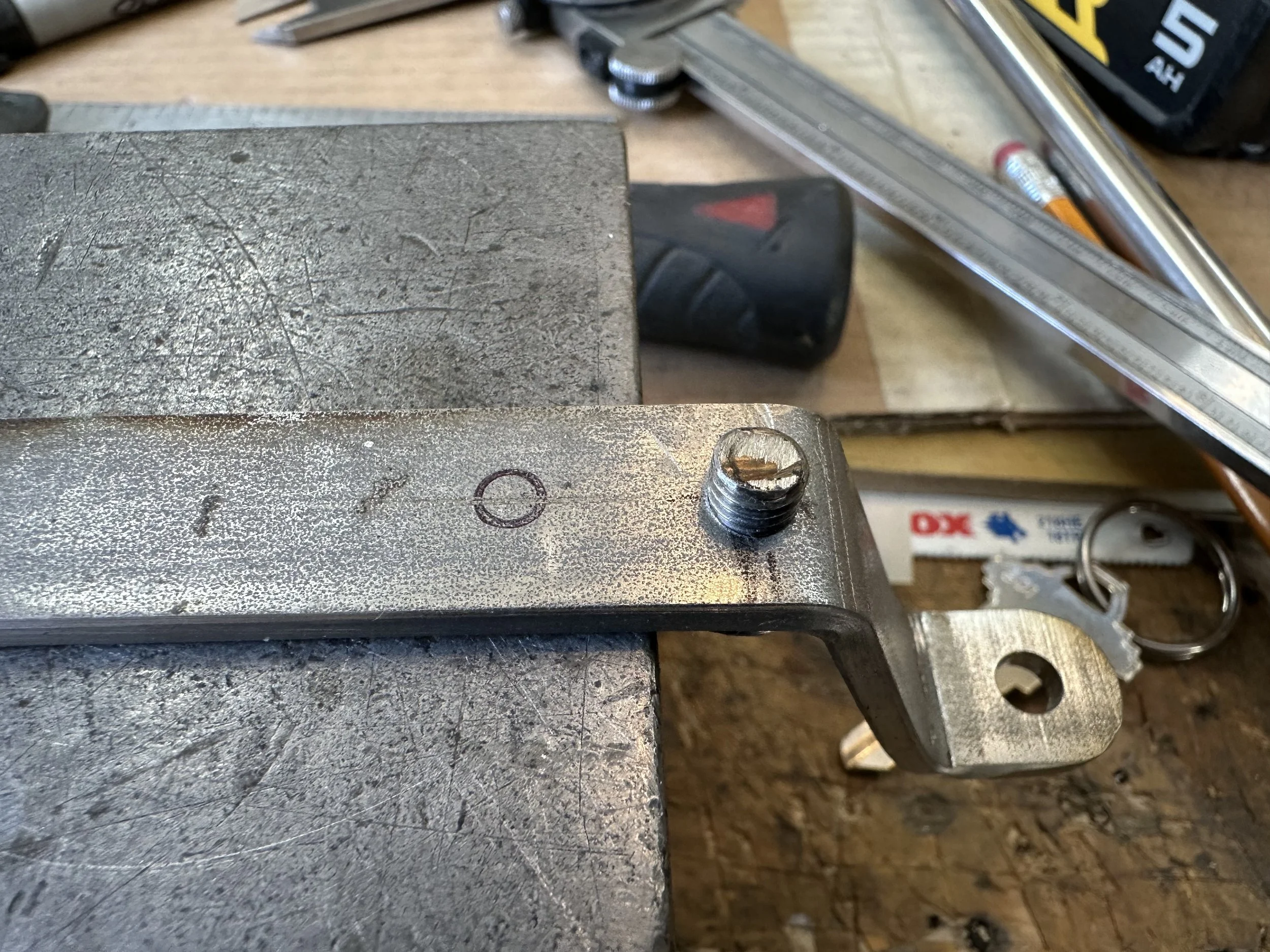   Then the pivot attachment bolt hole location was marked for drilling. This side of the screw acts as the counter weight locator.  