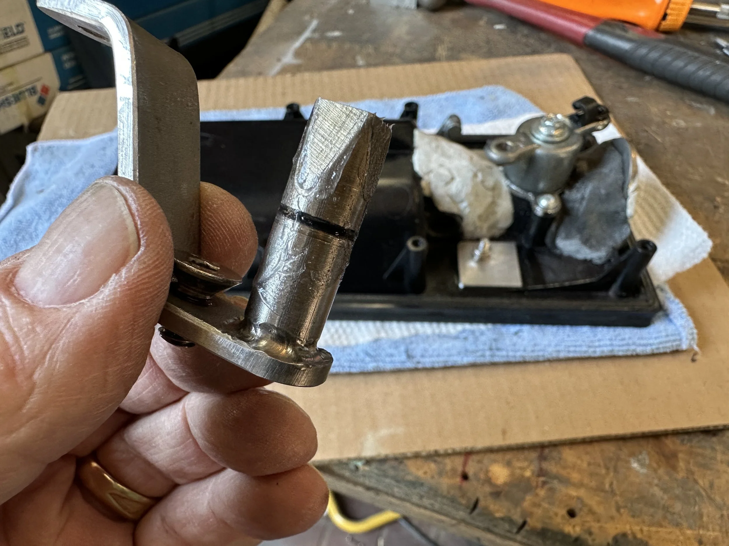   A little petroleum jelly was applied to the pivot shaft to aid in lubricating the hole in the housing.  