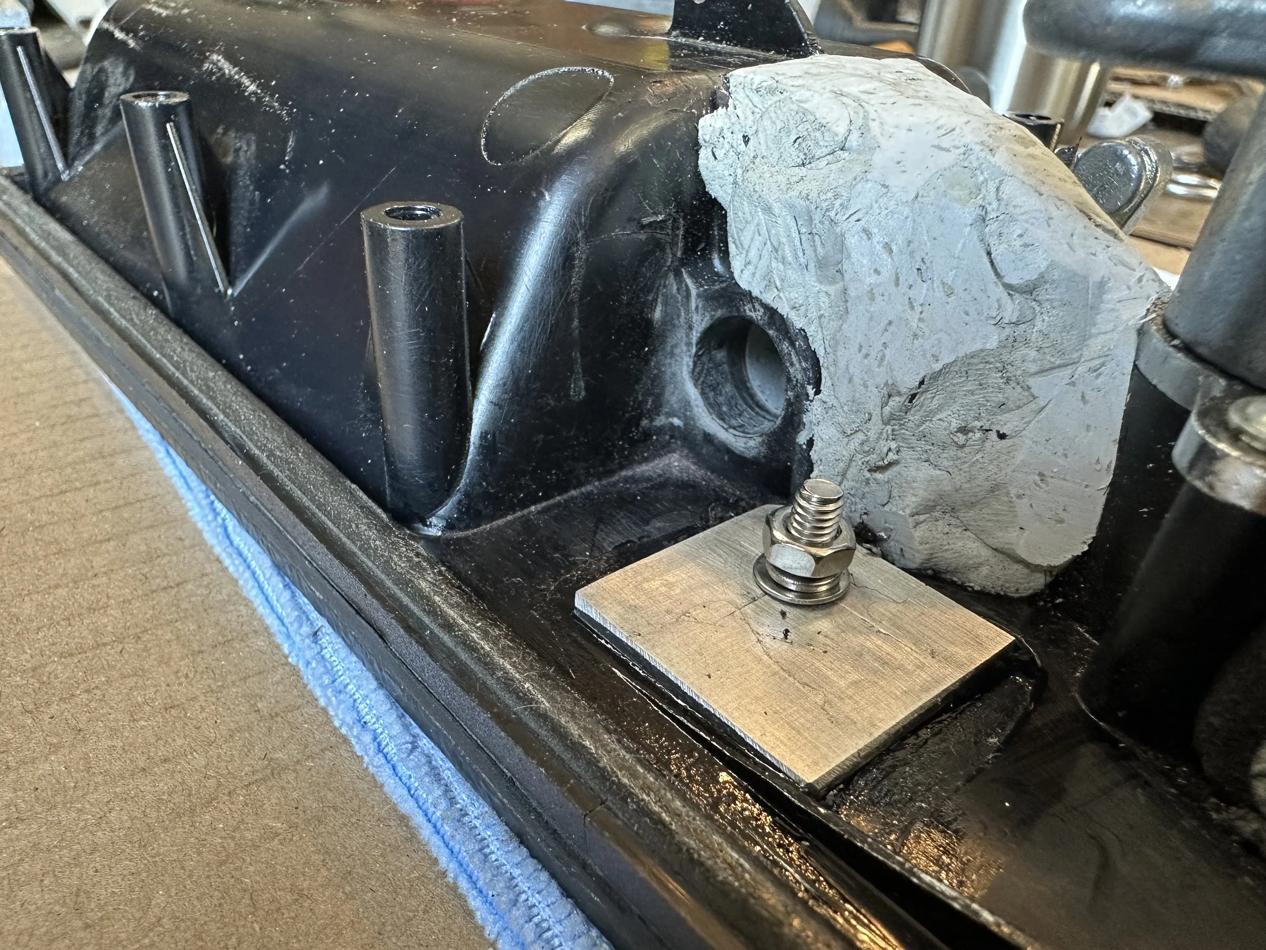   Because of the crack through the facia panel that now migrated into the pivot housing, I installed two backing plates to sandwich the plastic parts between two metal ones. These plates were glued to the inside plastic using CA glue.  