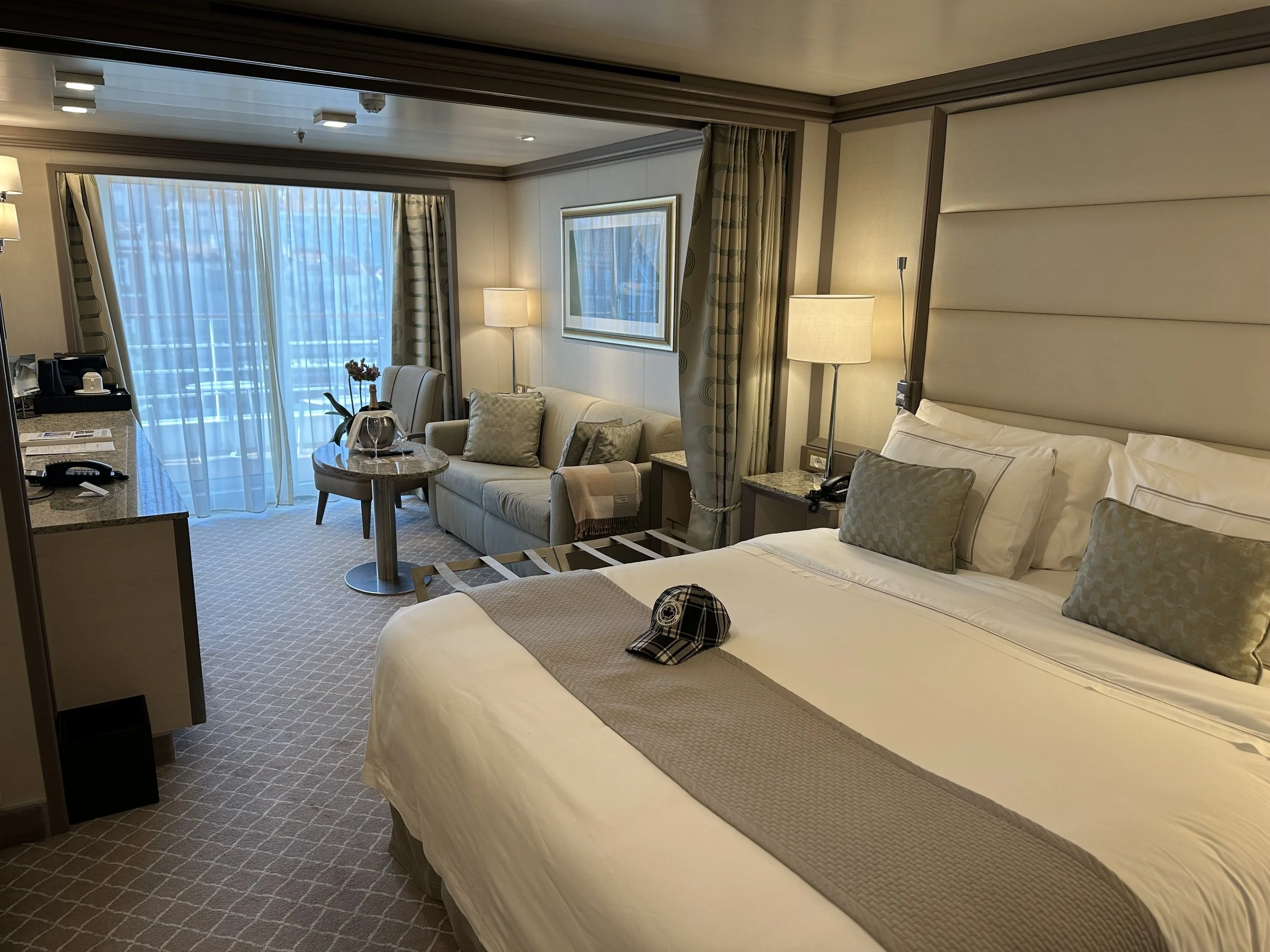 Our Veranda Suite with queen size bed, seating area and sundeck.