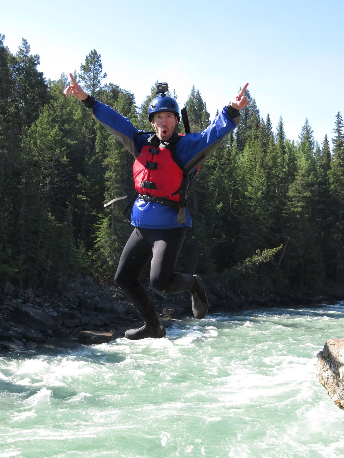 We found this super fun picture of Jon jumping off the cliff while drinking tea and having snacks! Photo: Chinook Rafting