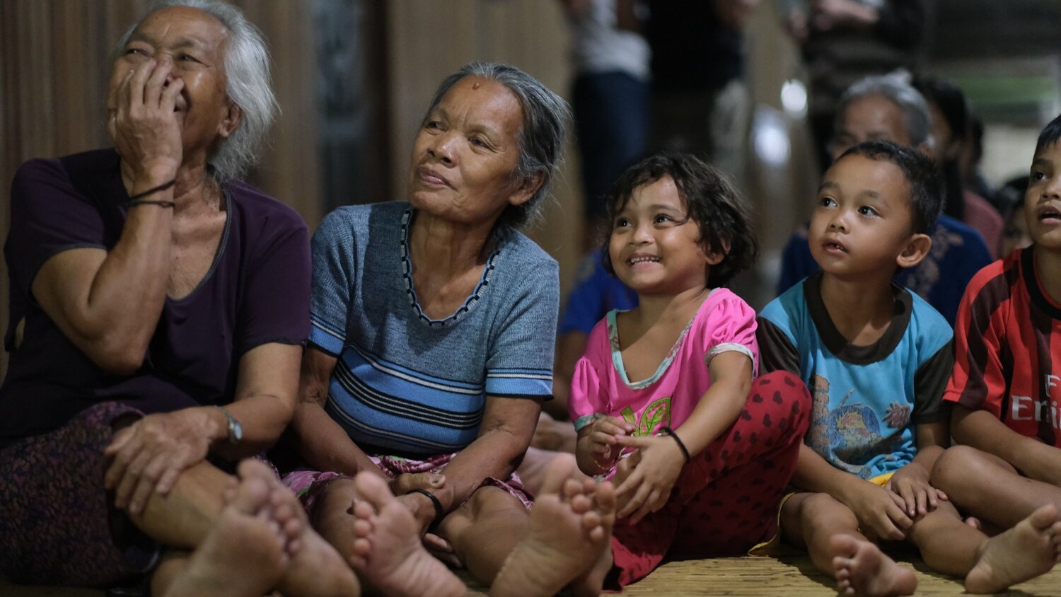 In our traditional longhouse, members of my community react to receiving the news that the Indonesian government had just given us full rights to our land. Kynan Tegar