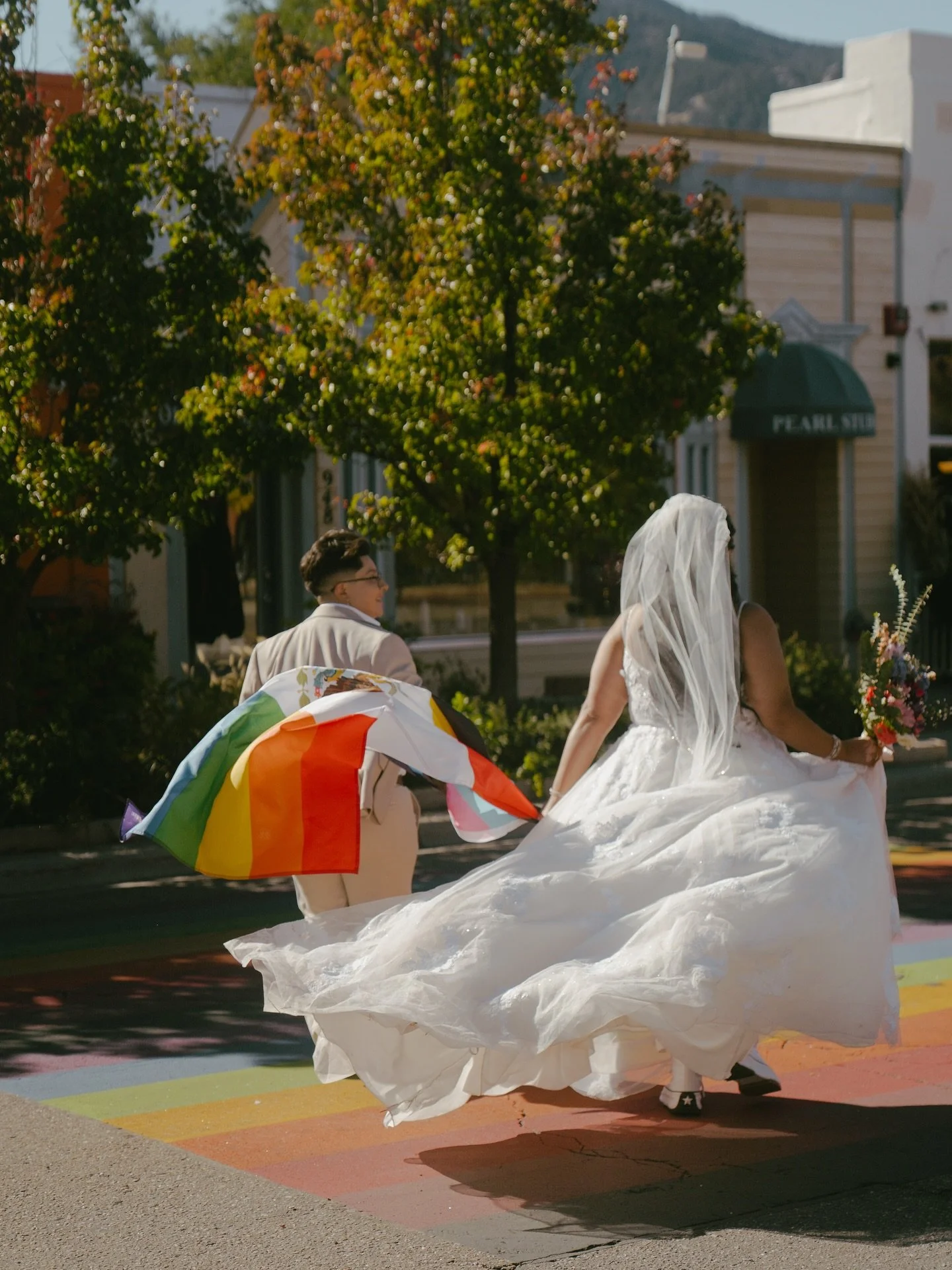 This short and sweet elopement in Boulder had my heart!
So many thoughtful touches went into their day so that their day felt truly theirs!
Having people stop and smile at these two running across the street with their pride flag made my queer heart 
