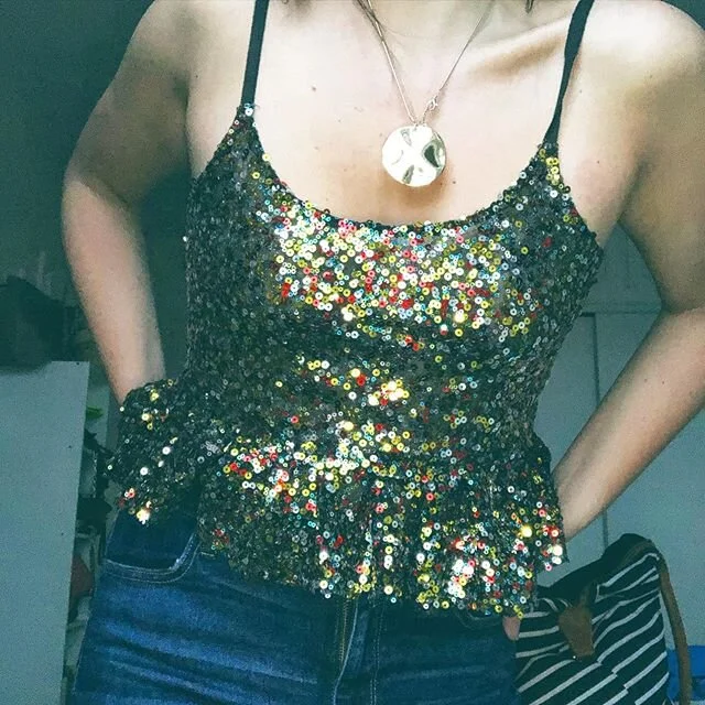 an upcycled NYE moment ✨ made this top from a too short, thrifted @freepeople dress for a cute sparkle look! Swipe to see what it looked like before :) #thriftflip #poshmark