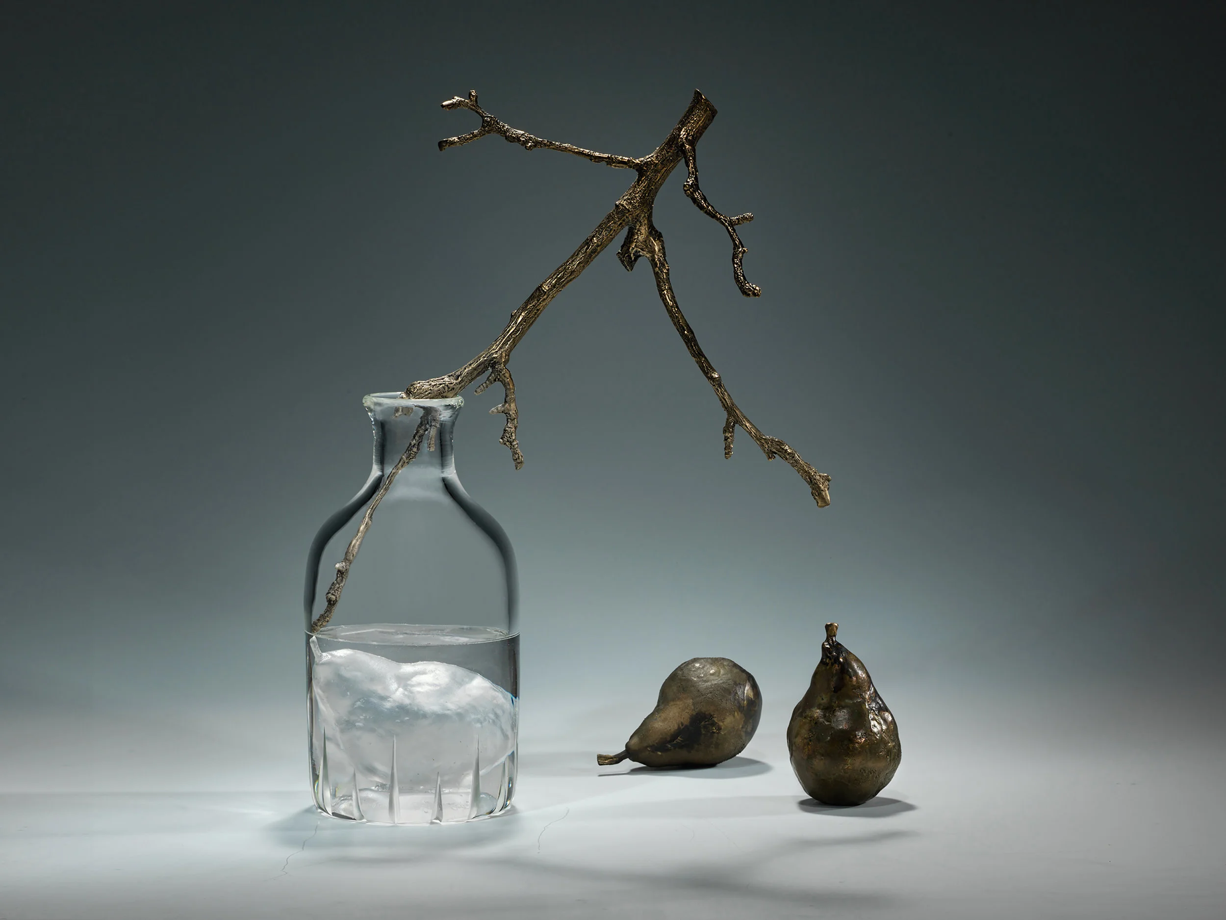 ‘Bottled Pear’, 2018, Cast + Blown Glass / Cast Bronze / Patina, 16” x 11” x 5”