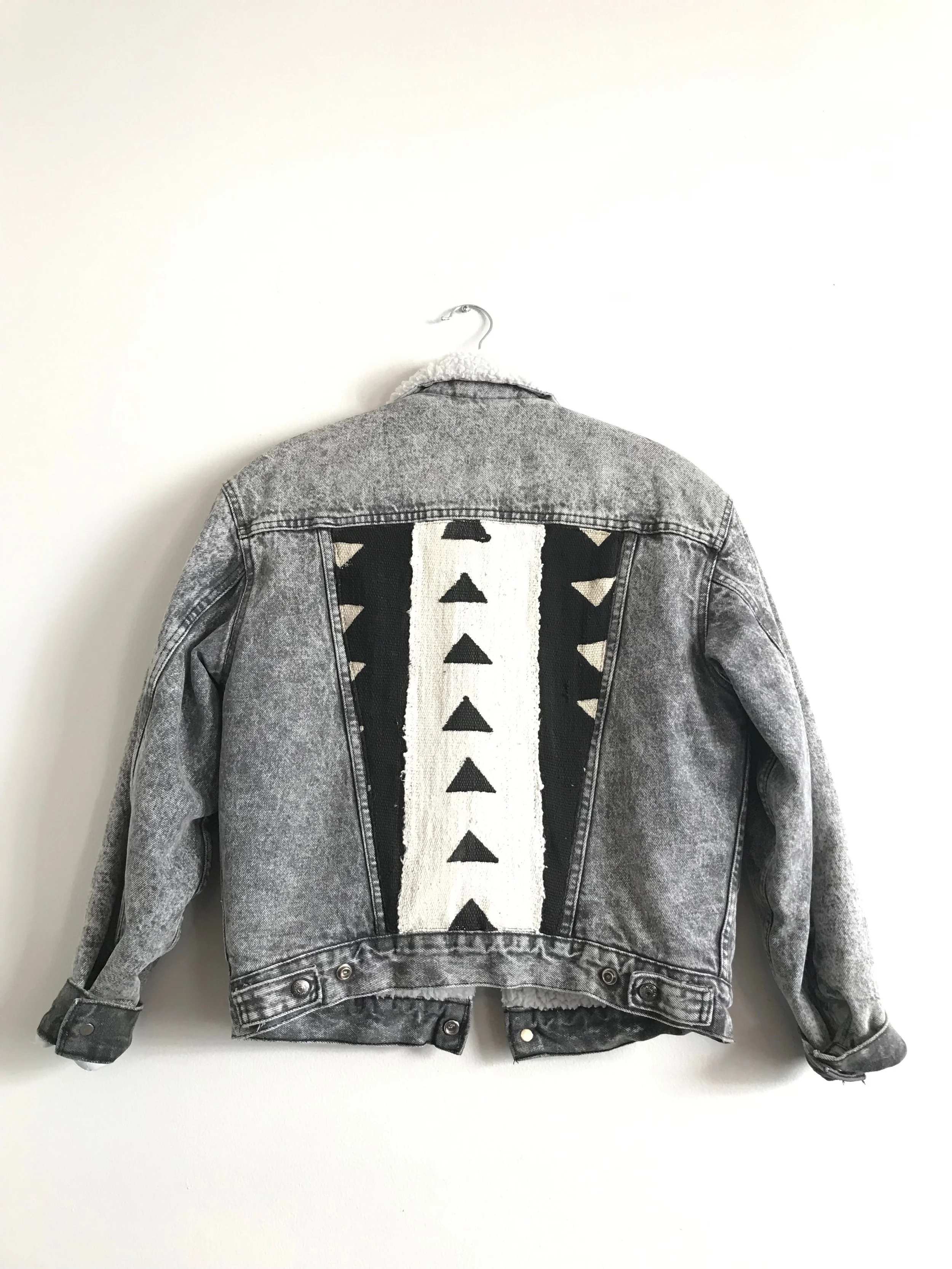 black jean jacket with designs
