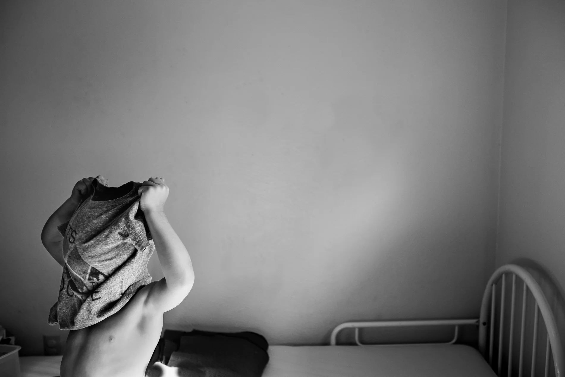 A child getting dressed.