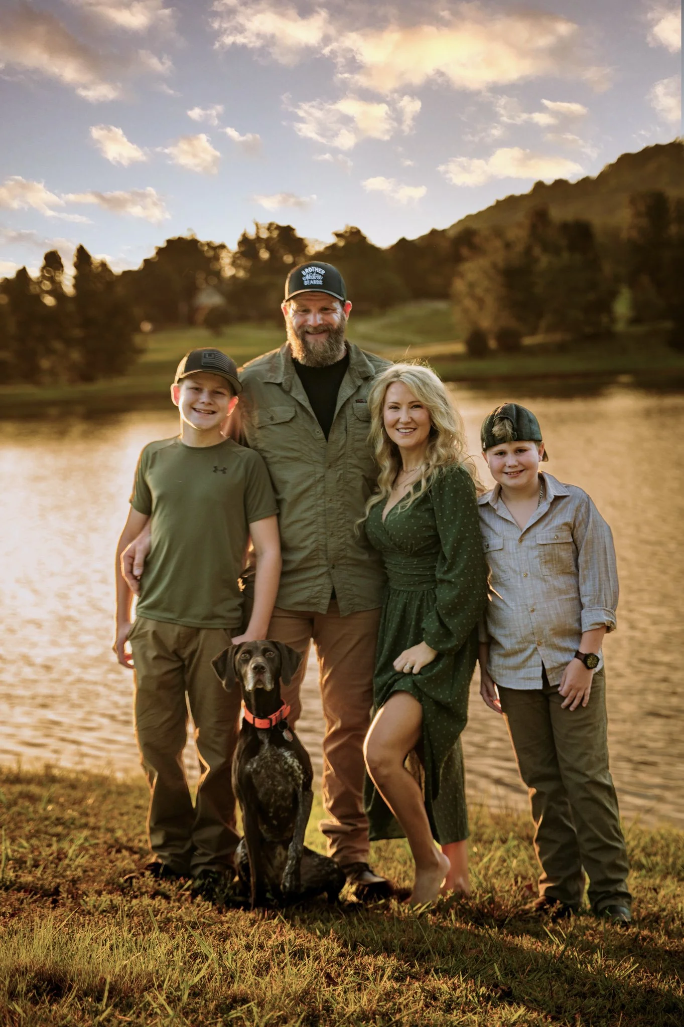 The Freshour family and their dog on a mountain lake at sunset, Western North Carolina
