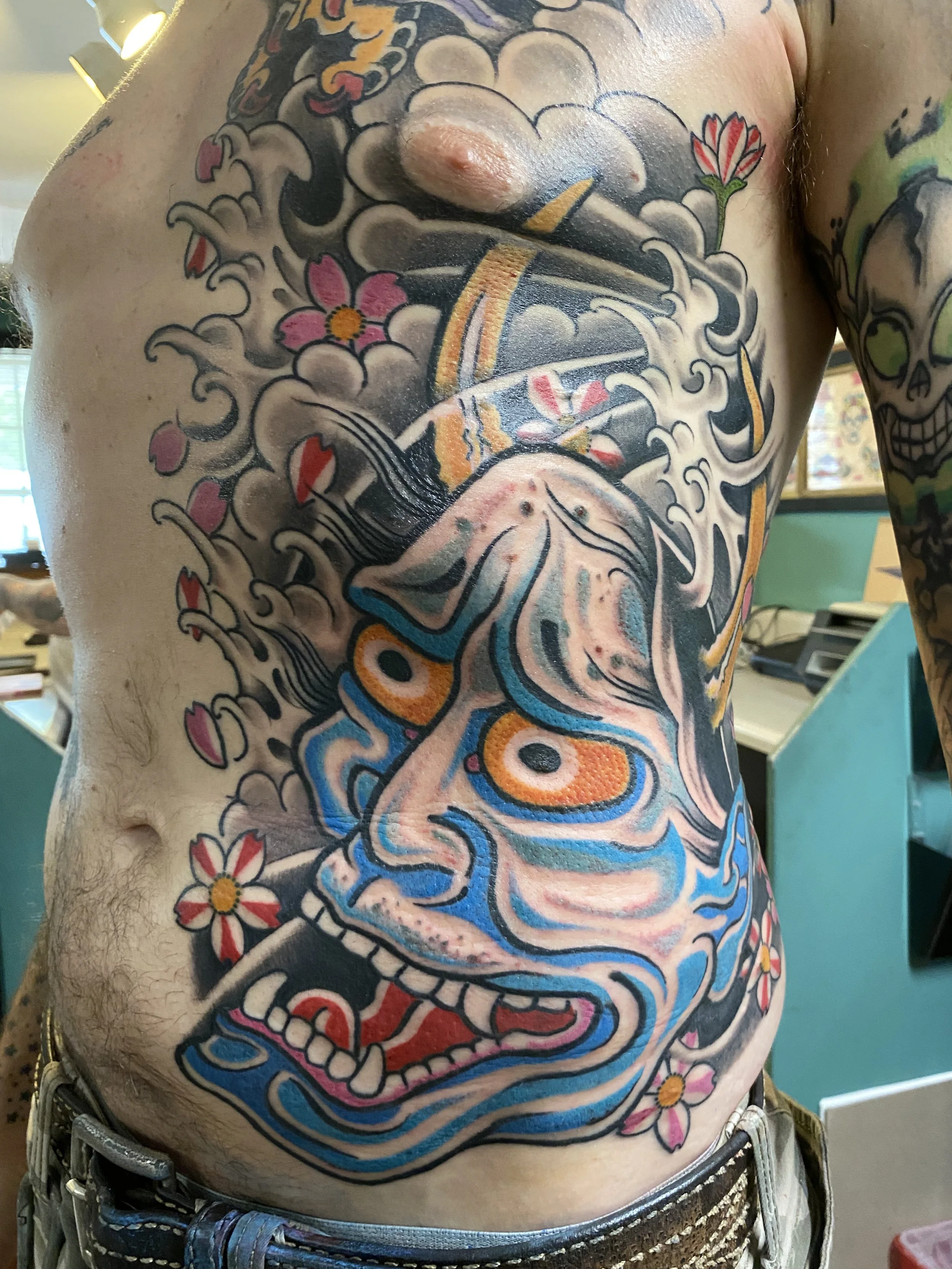 From Culture to Canvas: Japanese Hannya Mask and Cherry Blossom Tattoo by Paul Zapico