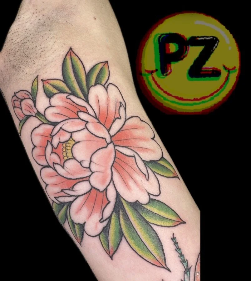  Japanese inspired peony tattoo on inner arm by Charleston SC tattoo artist Paul Zapico. Custom flash tattoo for women. Private studio serving North Charleston, Mount Pleasant and Summerville SC. 