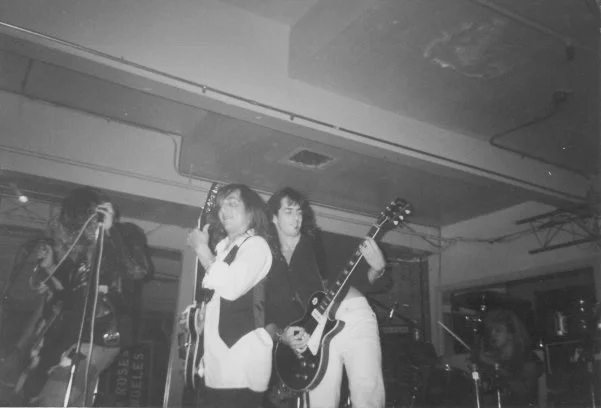 This is the Drunkfux gig at the Coconut Teaszer the day G n’ R’s Appetite for Destruction was released. It was also just days after we found out that our beloved friend Todd Crew had overdosed. A night of heavy, mixed emotions. This pic is of Steven Adler (drums), Duff (bass) and West Arkeen (guitar) from Guns n’ Roses, while my bro Del James (long time and current road manager for the band) sings and I’m equipped my favorite black Les Paul. (You may already know that since this time, Steven had a stroke and a couple of stints on Celebrity Rehab while West has also left us via overdose.)