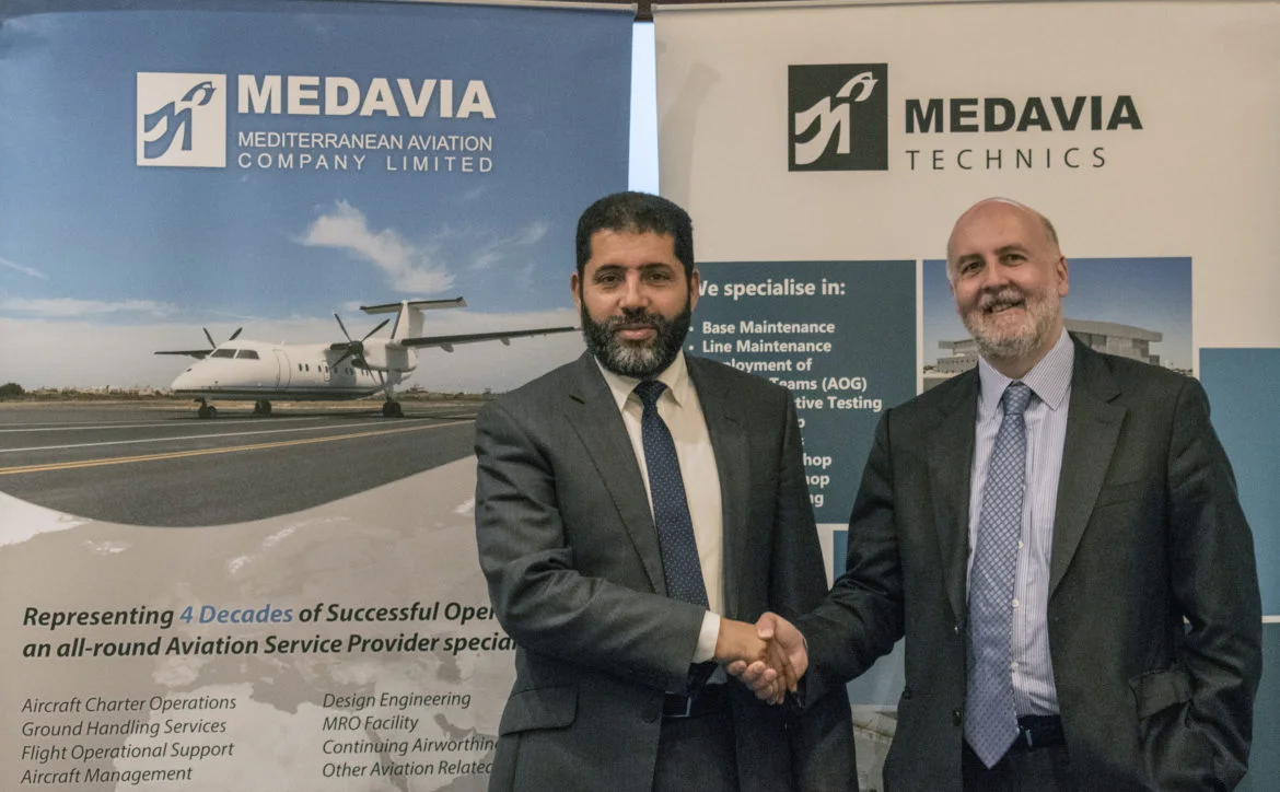 Medavia’s Managing Director Rammah B. Ettir shaking hands with Air Nostrum’s Managing Director Miguel Ángel Falcón Martín