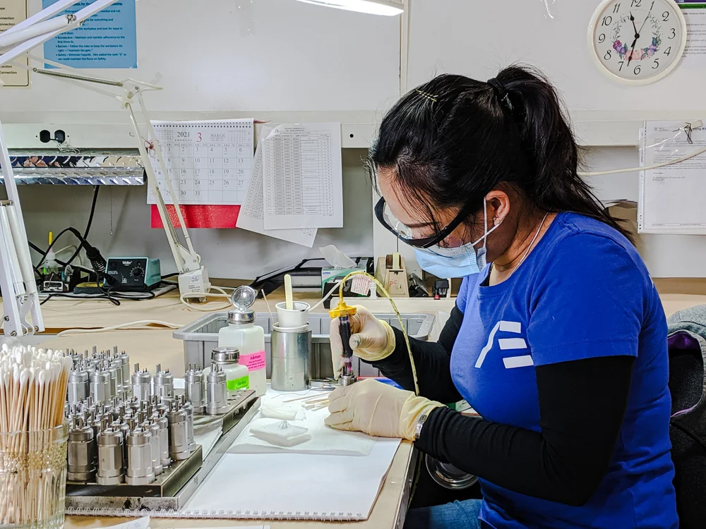 Technician assembling precision components
