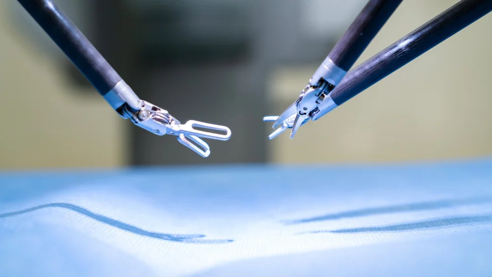 Robotic surgical instruments over a sterile drape