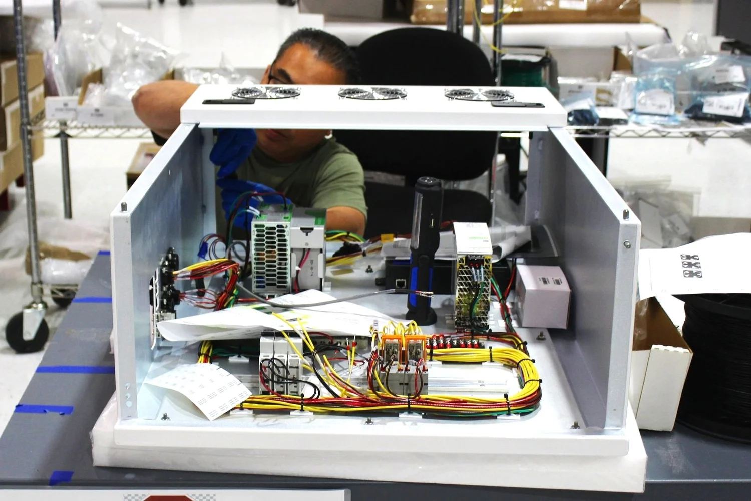 Applied Engineering technician assembling a semiconductor tool module