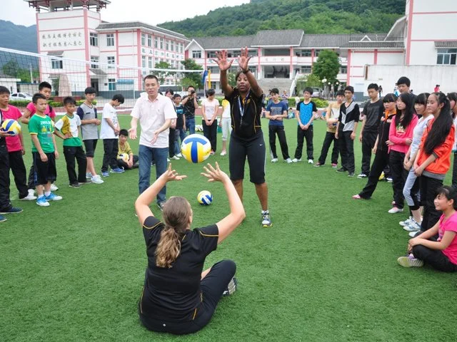 Alabama State University women’s volleyball head coach Penny Lucas-White and assistant coach Valerie Armstrong lead a Sports Envoy training session for students in Chengdu, China. 2013