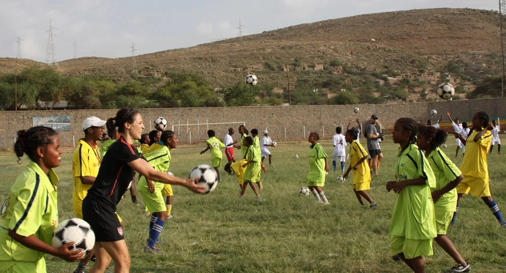 Sports Envoy and Former U.S. Women’s National Team member Kate Markgraf leads drills in Ethiopia. 2012. 