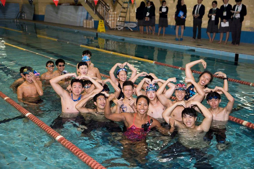 Sports Envoy and Olympic Swimmer, Lia Neal, leads swim workouts for youth in Hong Kong. 2017.