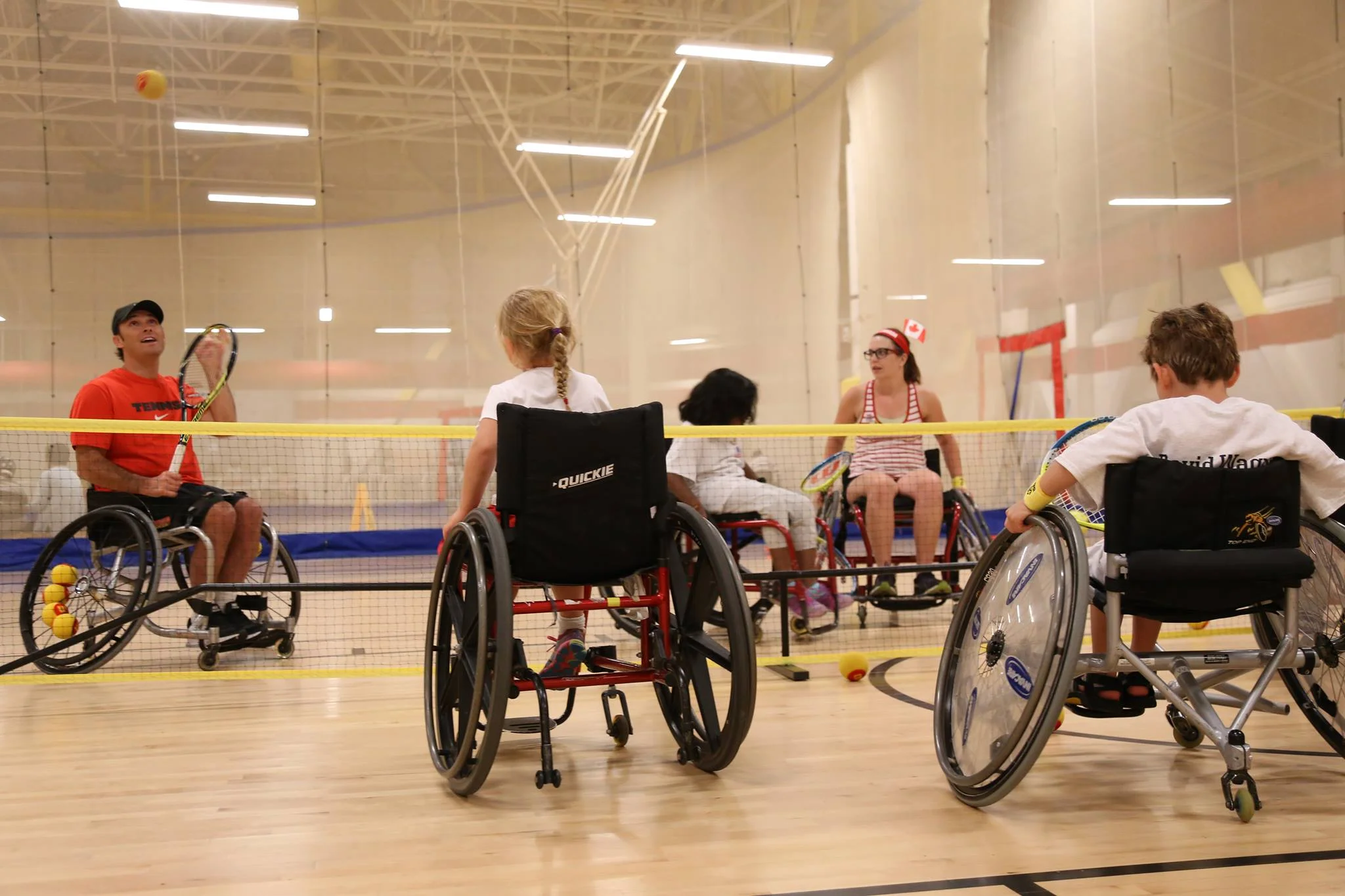Sports Envoy and U.S. Paralympic Team member, David Wagner, leads wheelchair tennis drills with youth in Canada. 2015. 