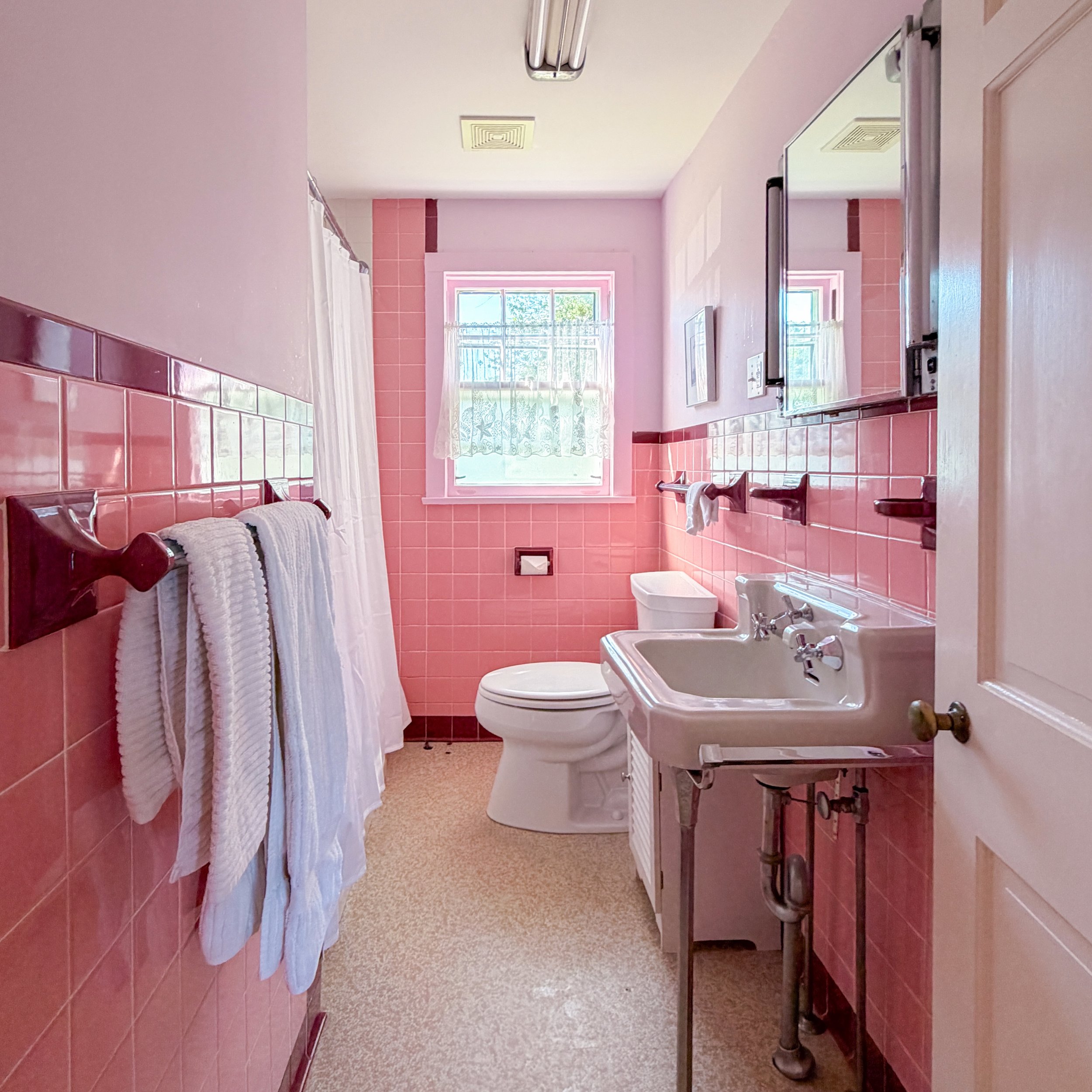 I kinda hope whoever buys this amazing Vineyard Haven home leaves this bathroom exactly as it is. #vintagebathroom #embracethepink #shesperfect #marthasvineyard