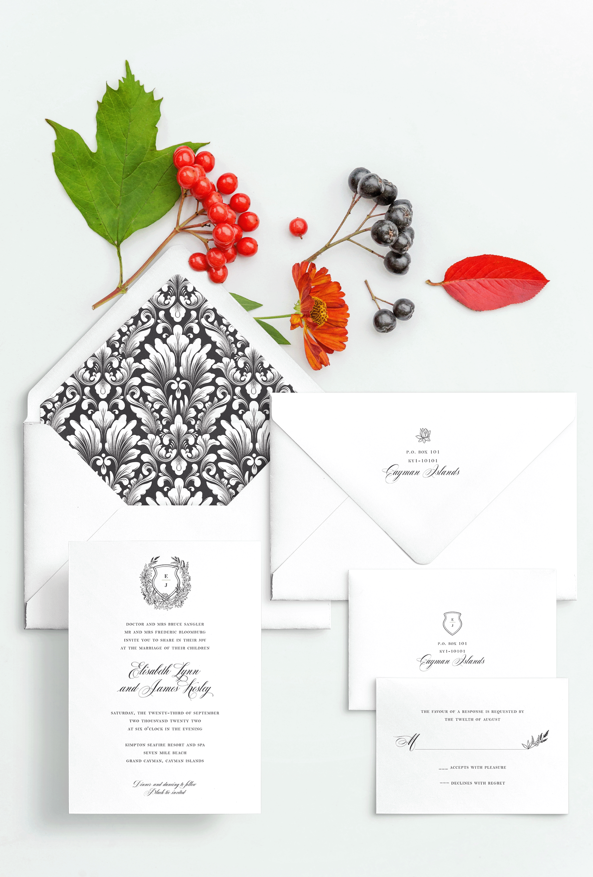 Semi-custom wedding letterpress invitations with coordinating Day-of-Wedding stationery and signage. Customizable. Design has foliage crest with initials and baroque pattern envelope liner featured in Black. Also available in foil.