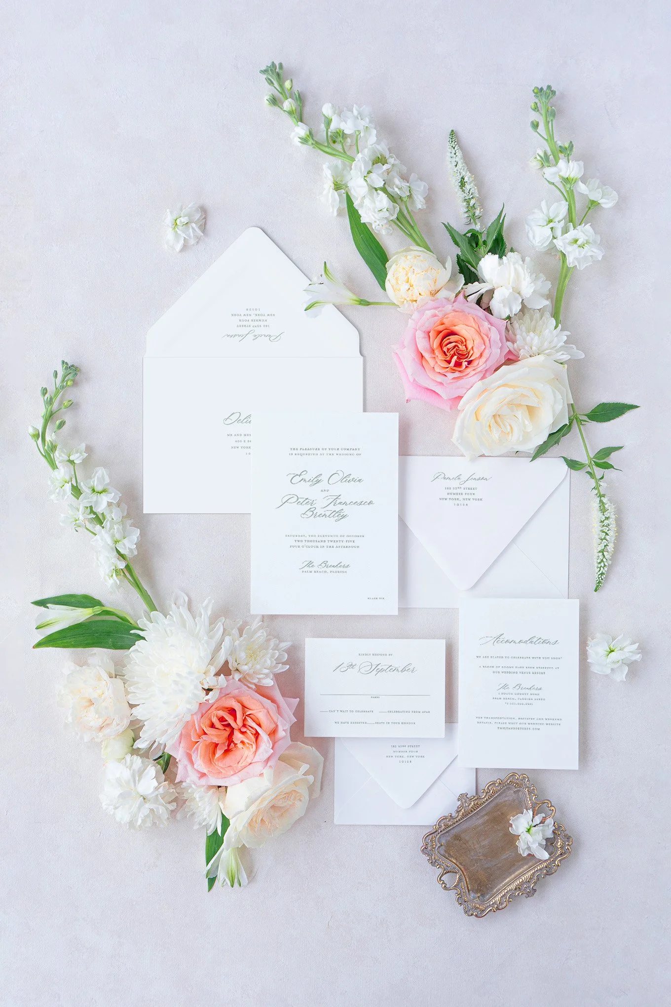 Heritage Collection luxury wedding invitation suite with soft tropical florals and refined neutral details.
