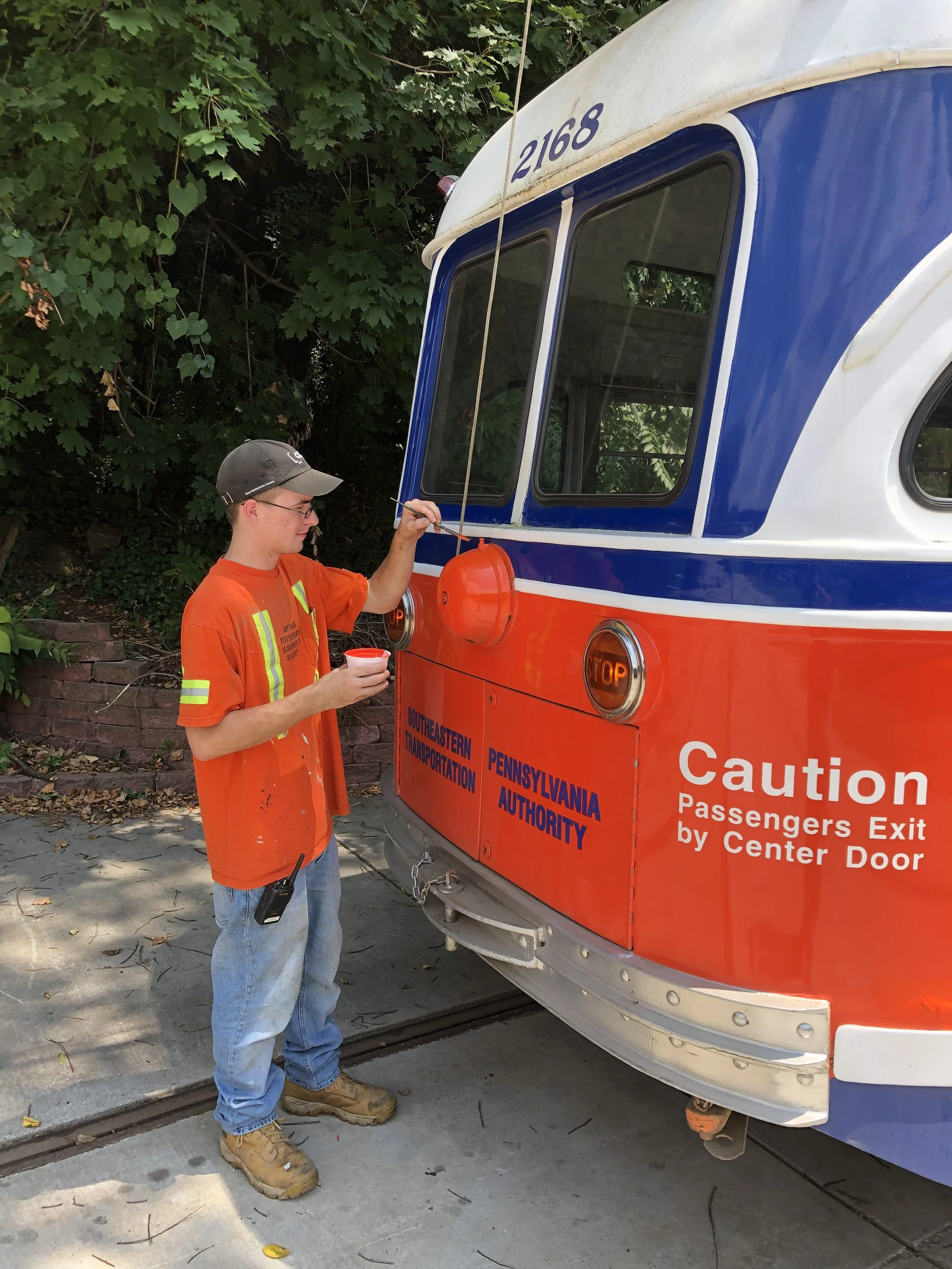 Logan Tracy touches up the paint on SEPTA #2168 in August 2019. As one of the most frequently used and popular cars at BSM, keeping this car in excellent condition is very important. Image Credit: Matt Nawn
