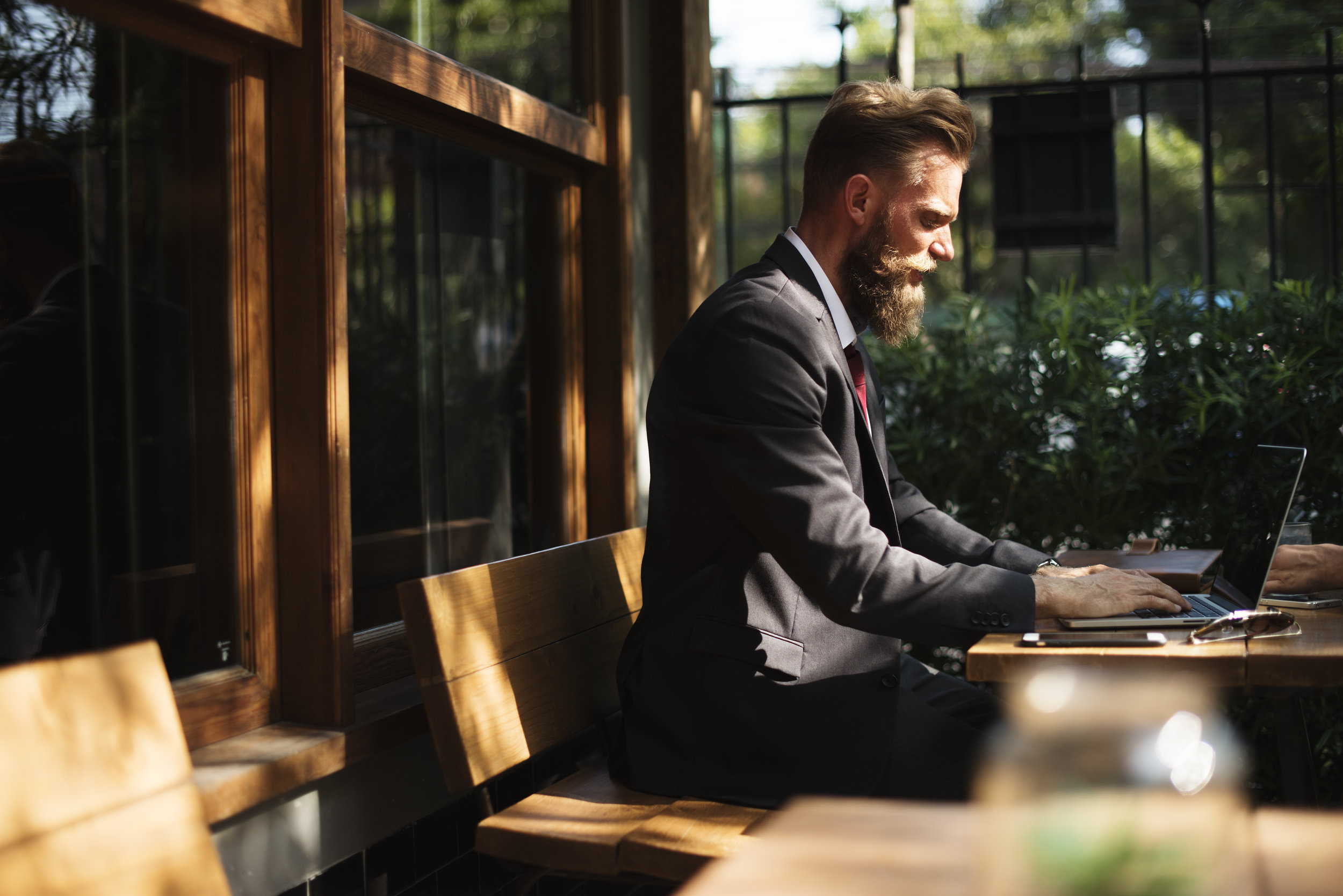 Man working with laptop at coffee shop