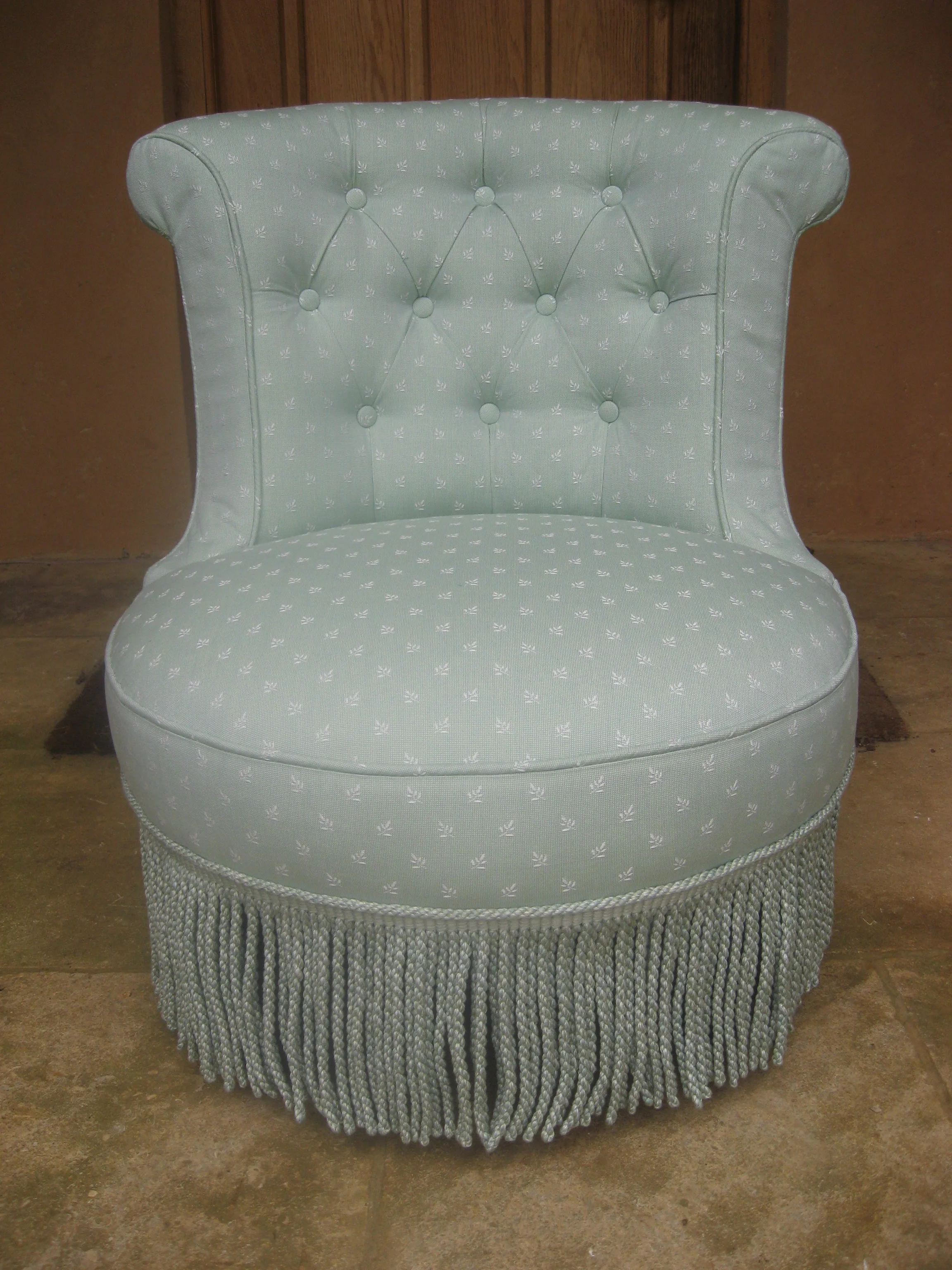 Deep buttoning and bullion fringe