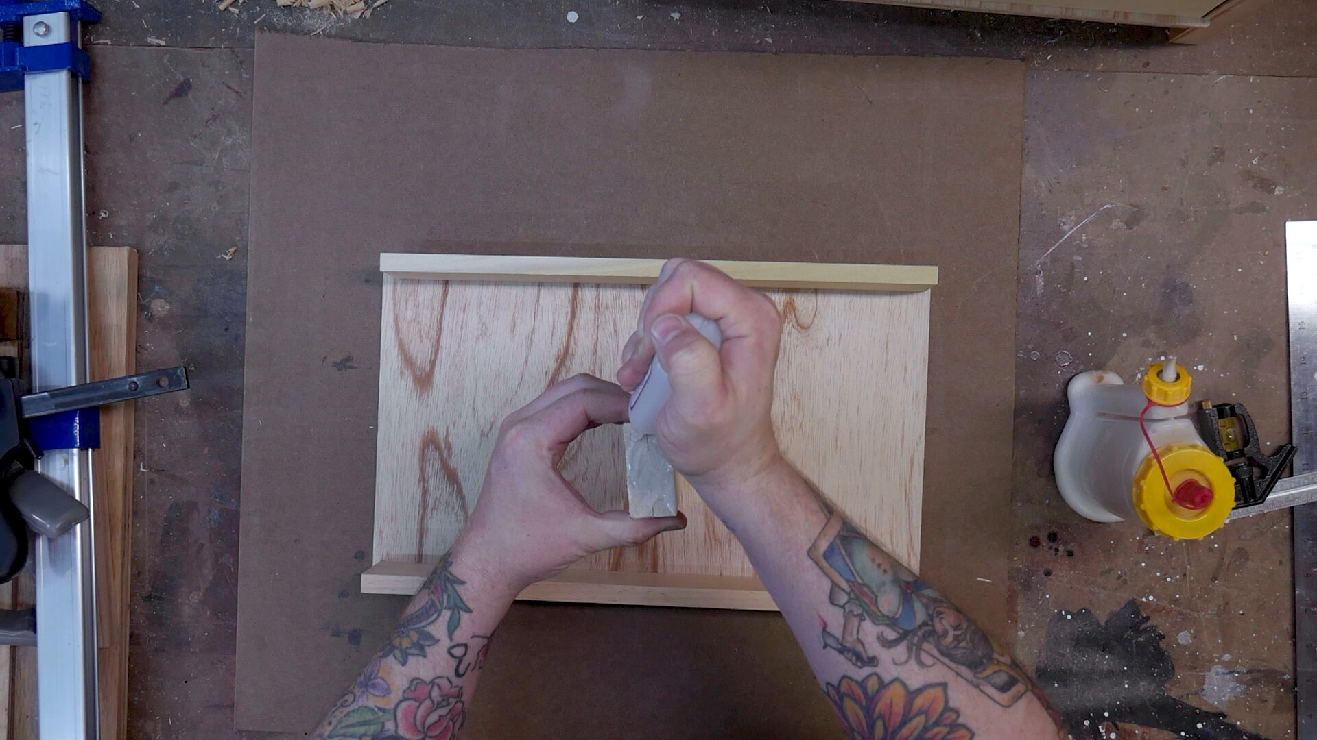  Gluing together the front, back and sides of the DIY tool chest. 