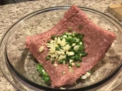 3. Add the chopped garlic and green onions