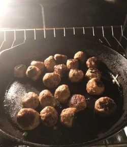 9. Place the meatballs into a preheated oven set at 375 degrees for 10 minutes to finish cooking