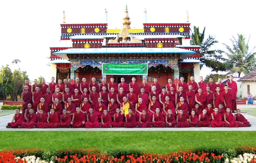 monks+infront+of+monastery+in+exile.jpg