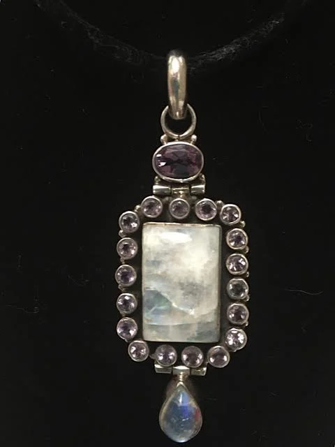 2 inch crystal pendant with amethyst stones