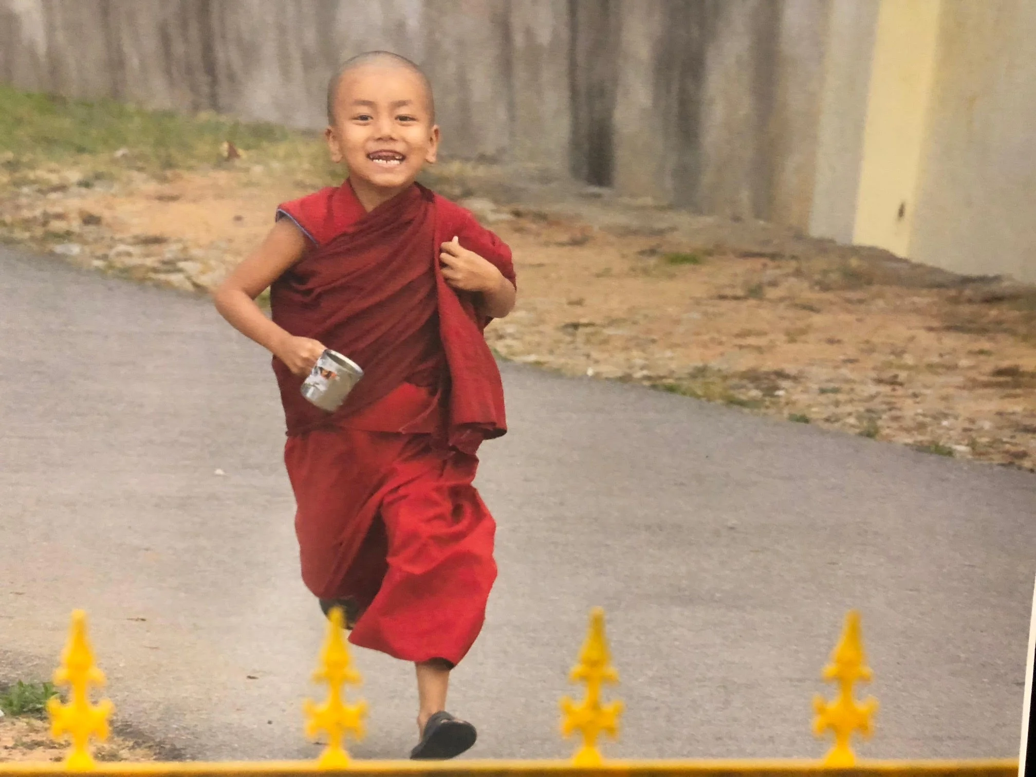 182_Legault-photo of young monk running with silver cup.jpg