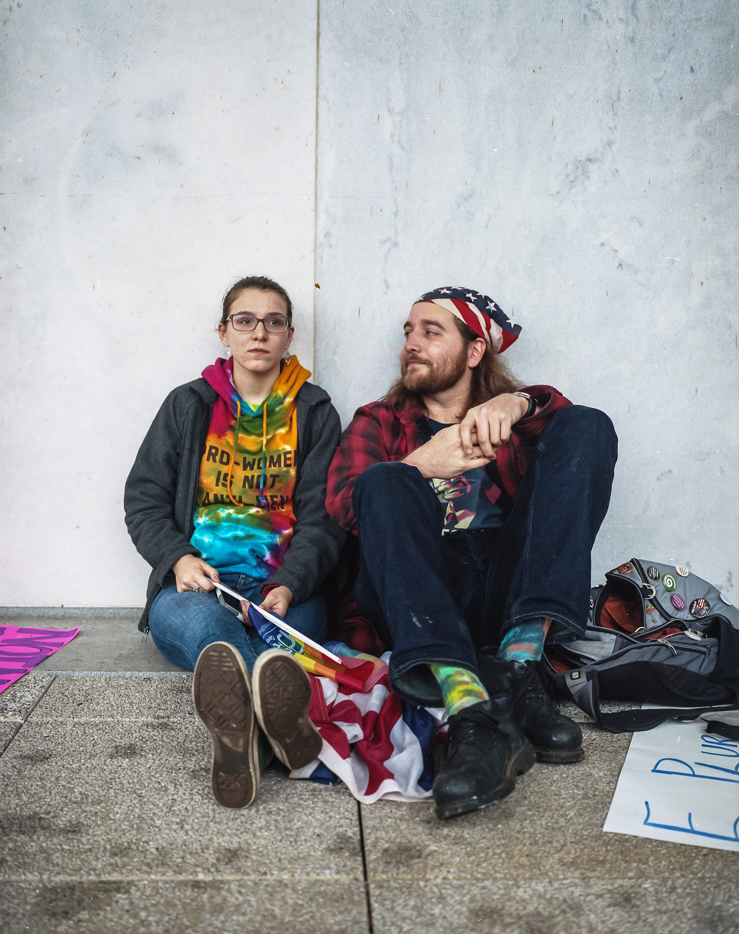 Kelsey Dickison, left, and Derek DeMello from Massachusetts "We came here to protest against hate and divisiveness. We come here to stand up for the beauty, love and diversity that make this nation great. E Pluribus Unum."