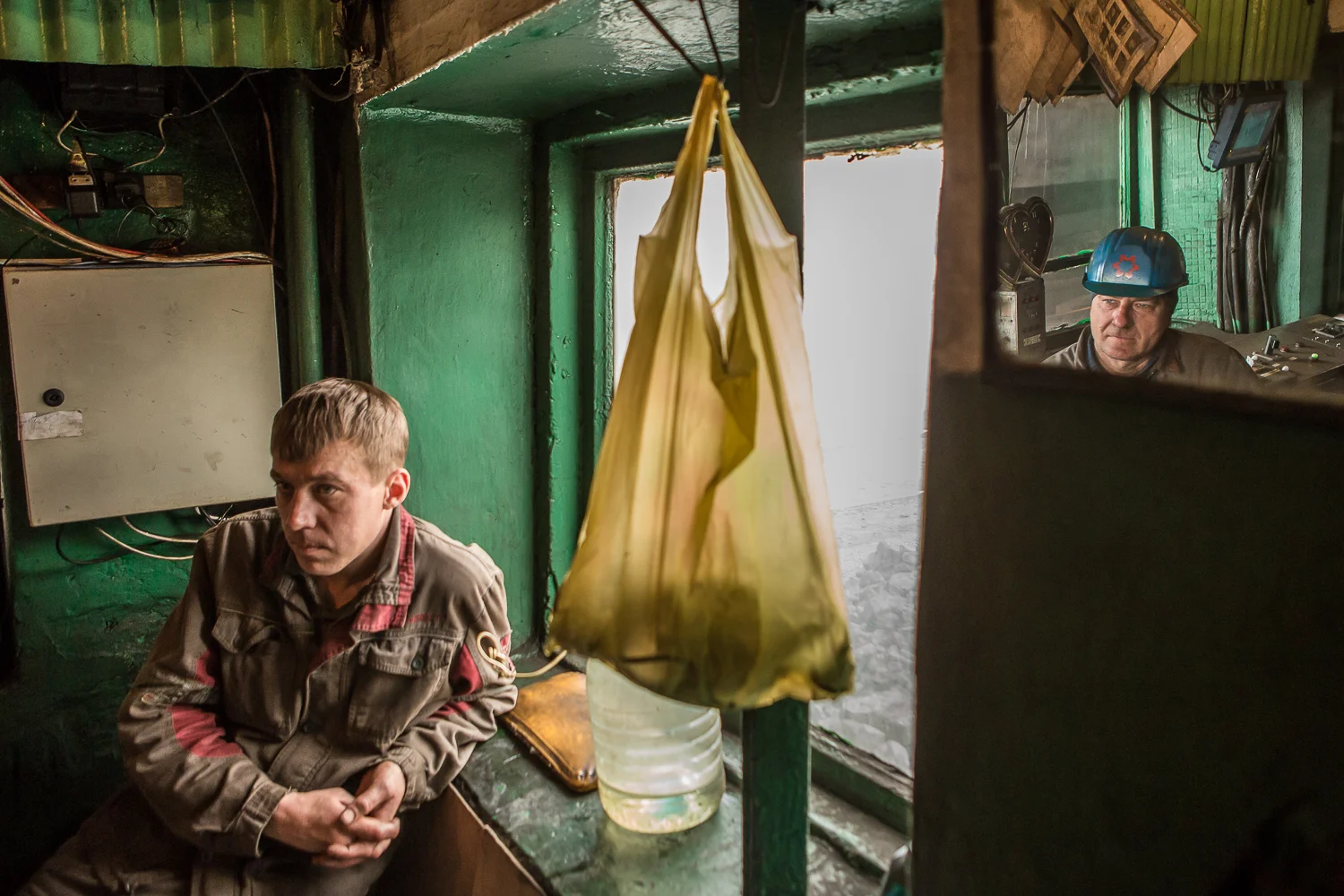 Workers sit in a cabin of the coal unloading department at the Avdiivka Coke and Chemical Plant in Avdiivka, Donetsk region, Ukraine on March 13, 2017