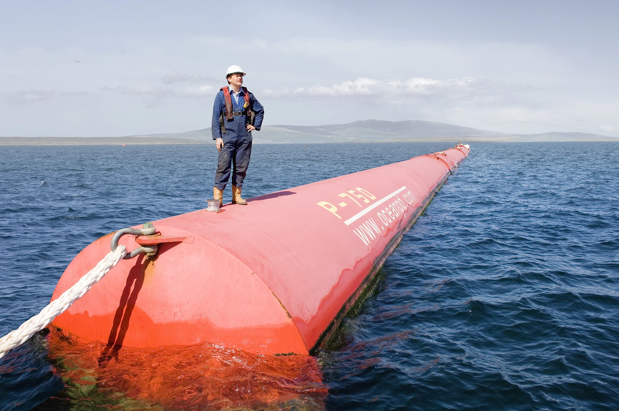 Developer on the Pelamis Wave Energy Converter in Stromness (Orkney's, Scotland). The Pelamis Wave Energy Converter is a technology that uses the motion of ocean surface waves to create electricity. The machine is made up of connected sections which…