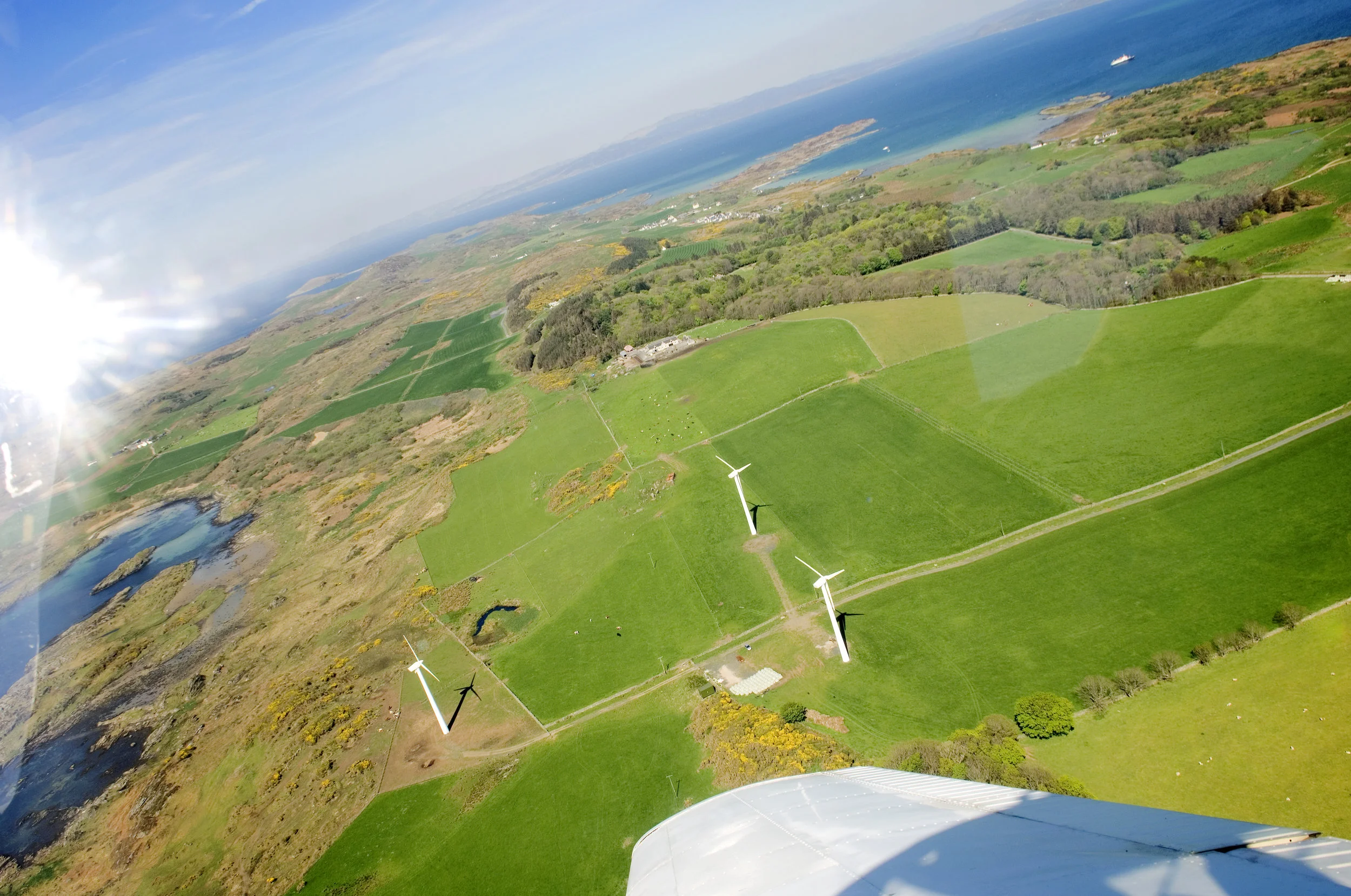 The little island of Gigha (Scotland) was in economic decline until the community invested in 3 wind towers. This little wind farm does not only supply the necessary power for the island, the power surplus is sold off and boosts the island's economy.