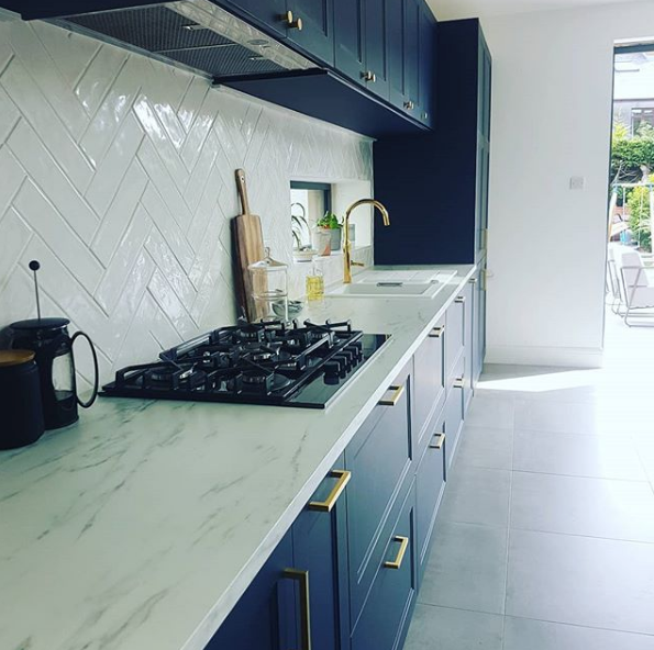 Scanidinavian inspired kitchen indigo blue with brass handles.png