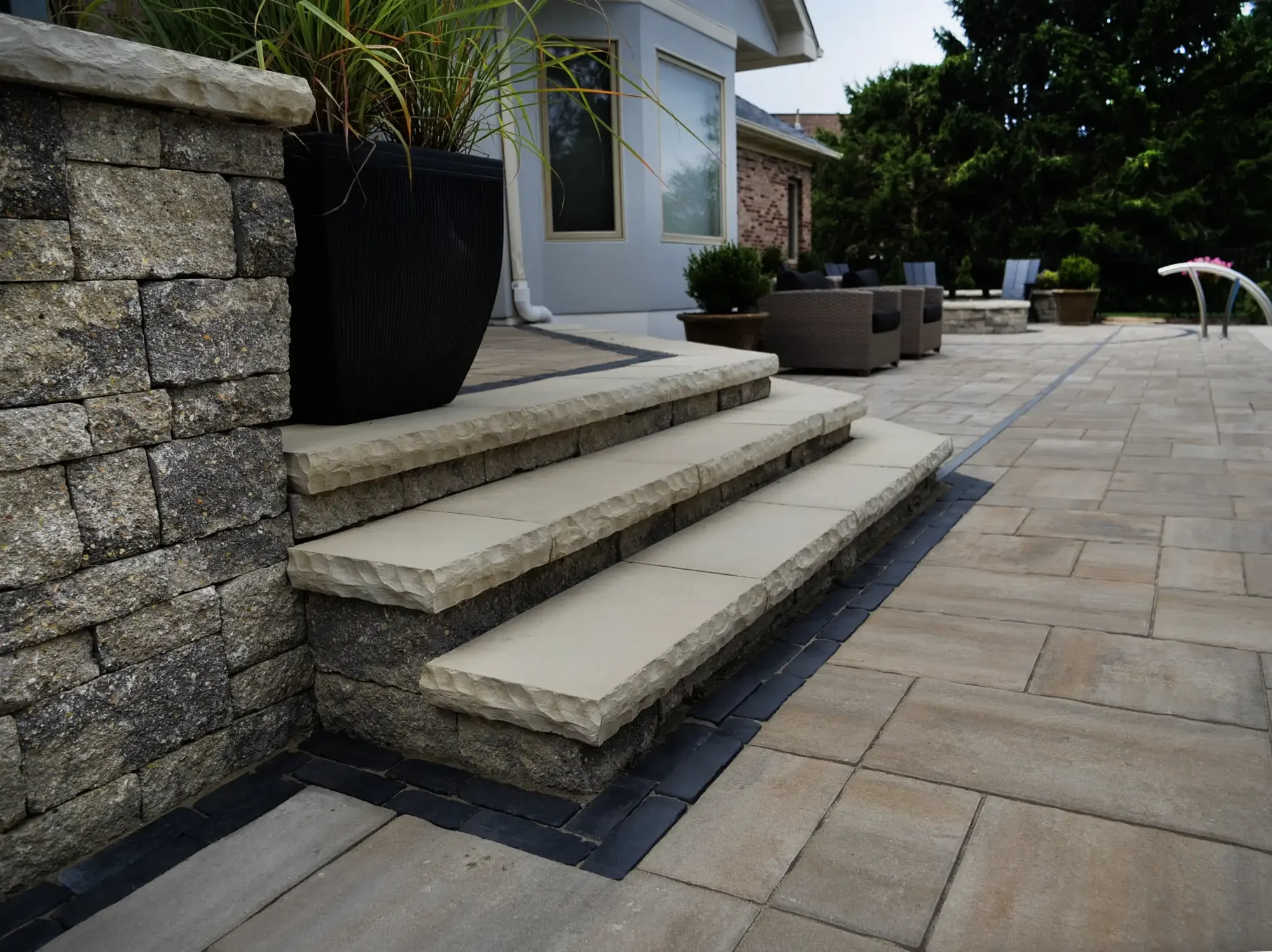 Natural stone steps with dark paver border detail by Green View in Illinois