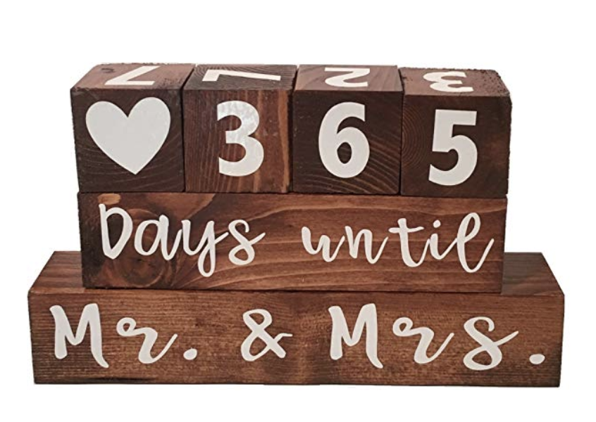 Wedding Countdown Calendar - Count down the days to the big day with this wooden wedding countdown calendar. Adjust the blocks daily to count down towards your wedding and after you tie the knot, flip it to the other side and use it as an anniversary tracker to count upwards from “years since we said I do”.