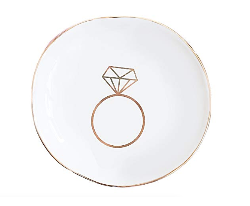 Engagement Ring Dish - Stash your sparkler safely with this cute engagement ring dish. This ceramic trinket tray will keep your engagement ring soap free while showering and prevent it from getting damaged while washing dishes.