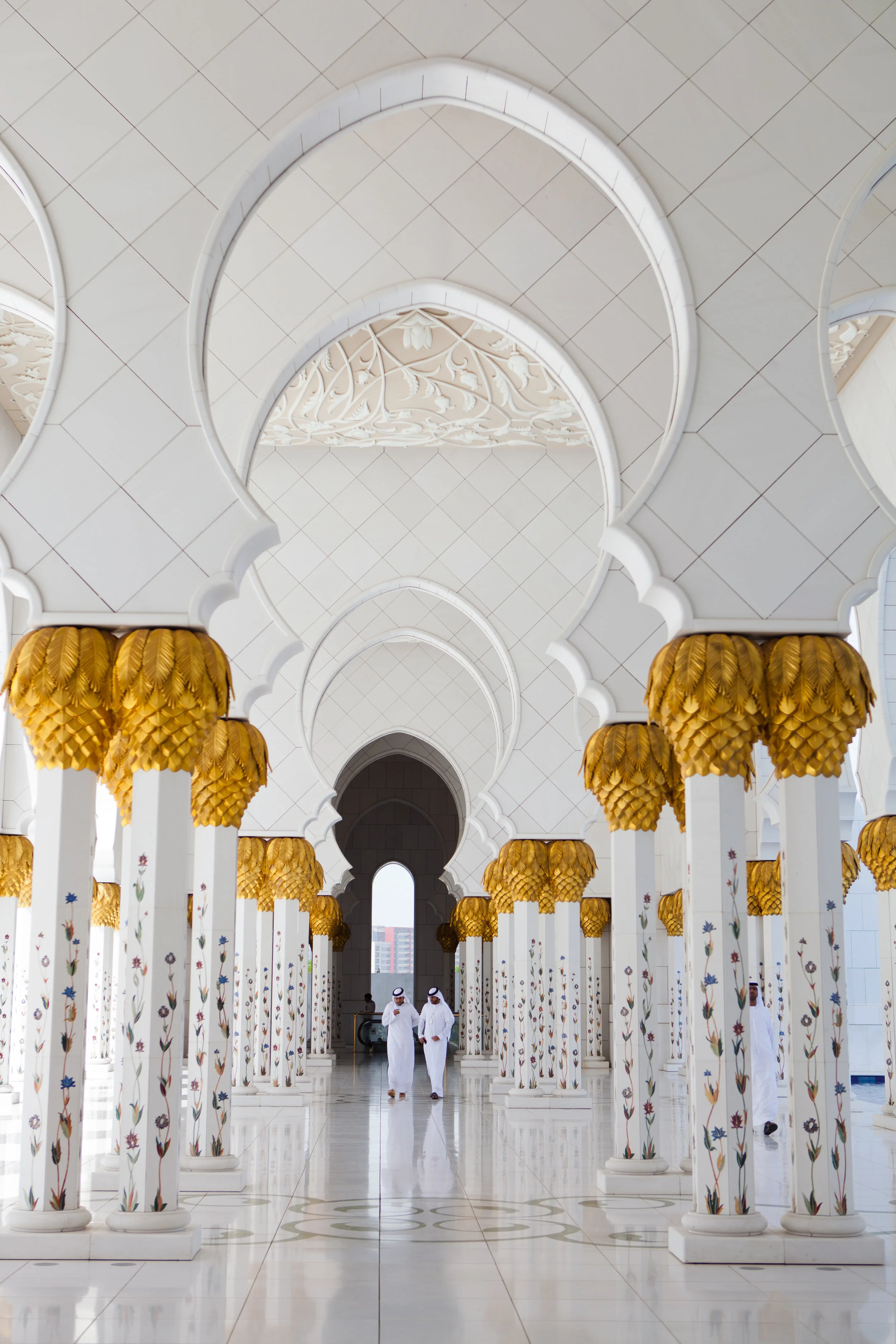 Had I not looked behind me while shooting the main portion of the Sheikh Zayed Grand Mosque in Abu Dhabi, I would have missed this moment between two local men.