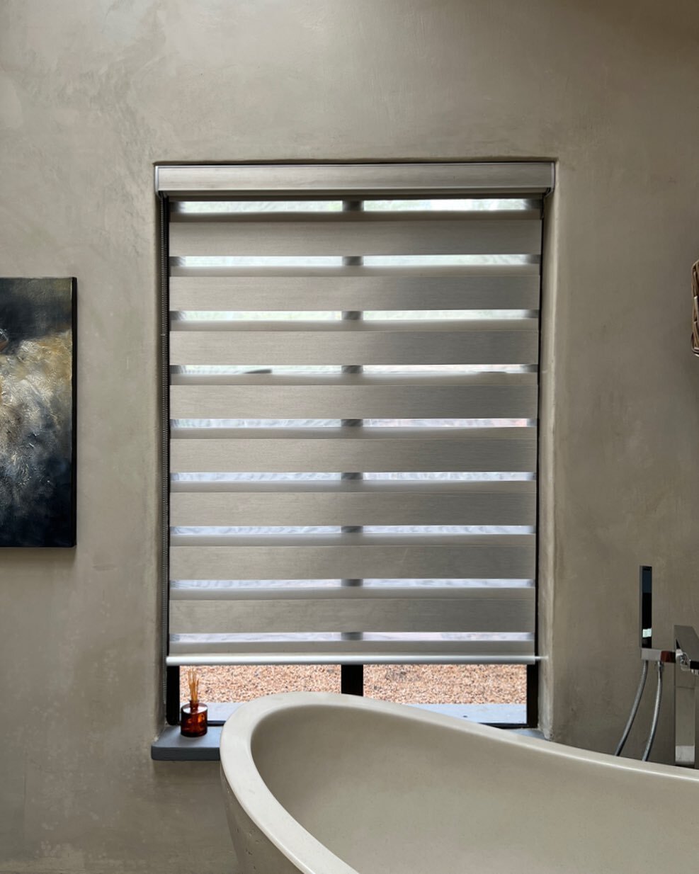 Vision Blinds offer an ideal balance between privacy and light control in a fashionable manner.

A Vision Blind features two layers of translucent and opaque horizontal striped fabric. A single control allows the front layer to move independently of 
