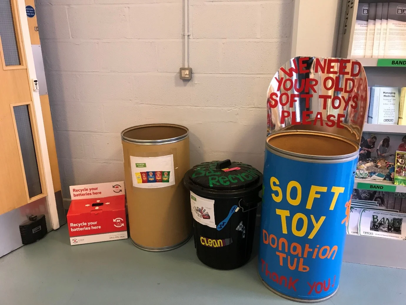 The recycling area at Scrapstore House, from left to right: batteries, crisp packets, oral hygiene waste, and soft toys.